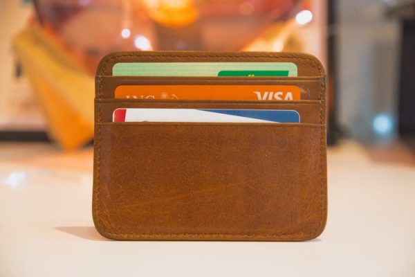 Payment cards in a brown leather card holder